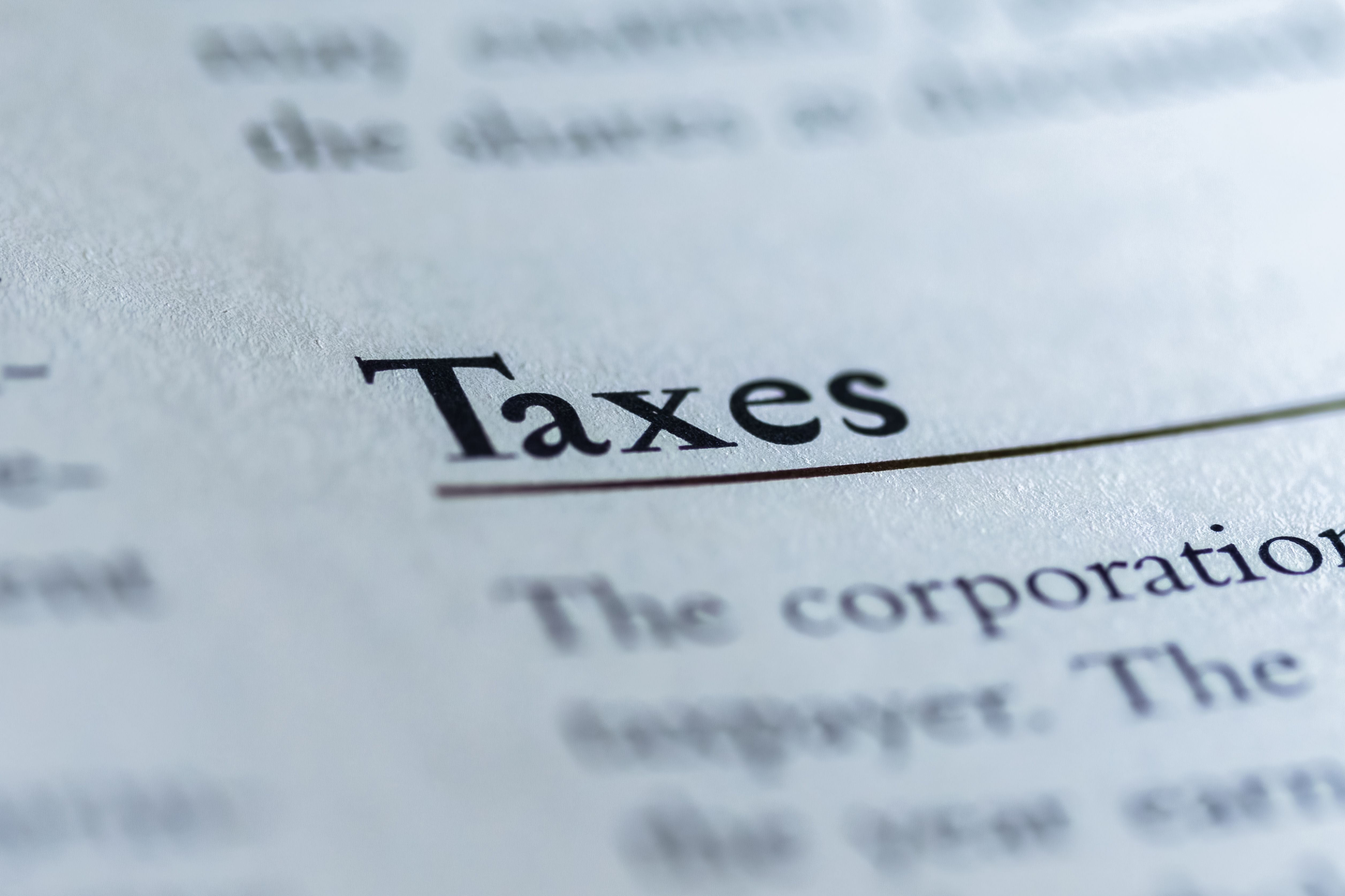 business owner reviewing financial reports for UAE corporate tax filing and compliance